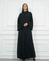 عباية رسمية سادة بقصات وبريم - tahaniboutique