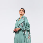 Practical armband, hand-embroidered with rayon threads and soft quilting.