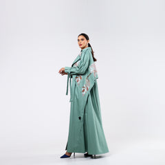 Practical armband, hand-embroidered with rayon threads and soft quilting.