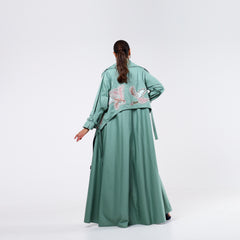 Practical armband, hand-embroidered with rayon threads and soft quilting.