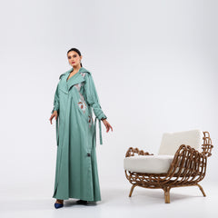 Practical armband, hand-embroidered with rayon threads and soft quilting.