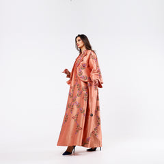 A very elegant dress-shaped armband, distinguished by its hand embroidery.