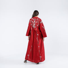 A very elegant and luxurious dress, distinguished by its handwork, sequins and embroidery.