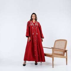 A very elegant and luxurious dress, distinguished by its handwork, sequins and embroidery.