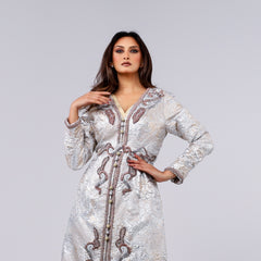 A handcrafted piece of art made of woven fabric, threads, sequins and Japanese beads. A 4-piece dress.