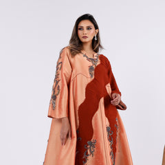 A soft, elegant gown with hand embroidery.