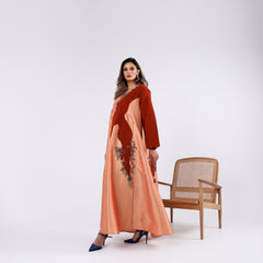 A soft, elegant gown with hand embroidery.