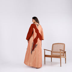 A soft, elegant gown with hand embroidery.