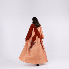 A soft, elegant gown with hand embroidery.