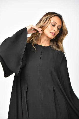 Plain, formal, triple-cloche abaya with vertical cuts from Tahani Boutique
