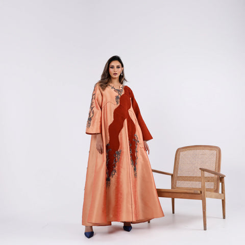 A soft, elegant gown with hand embroidery.