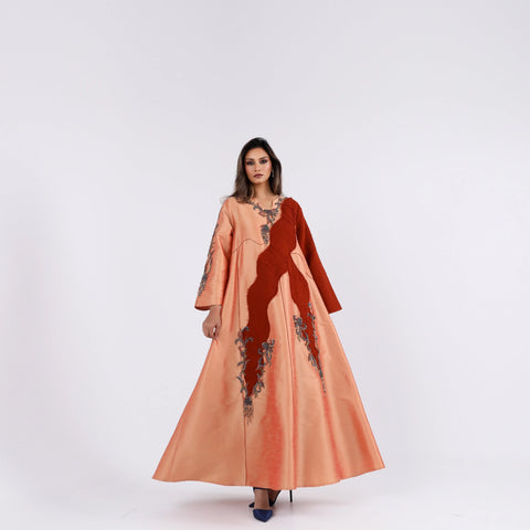 A soft, elegant gown with hand embroidery.