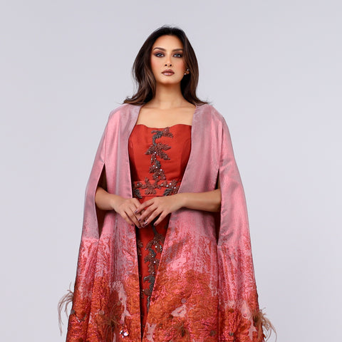 A handcrafted piece of art made of woven fabric, threads, sequins, Japanese beads and soft feathers.