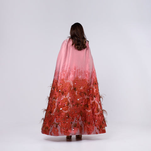 A handcrafted piece of art made of woven fabric, threads, sequins, Japanese beads and soft feathers.