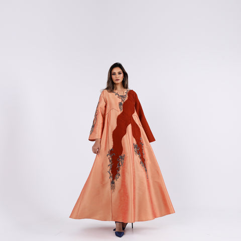 A soft, elegant gown with hand embroidery.