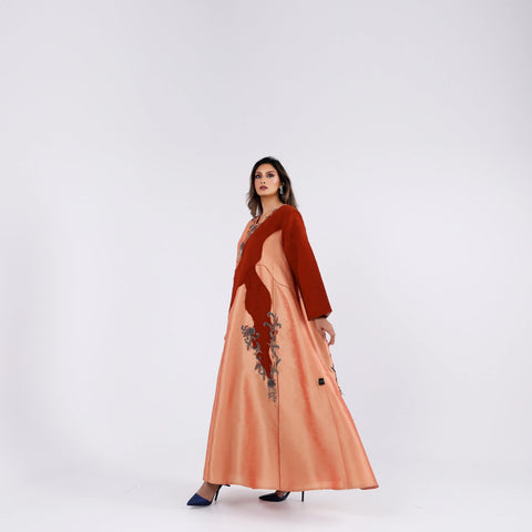 A soft, elegant gown with hand embroidery.