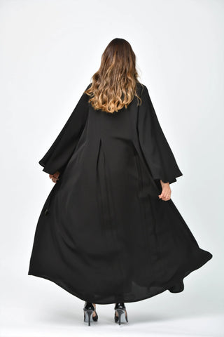 Plain, formal, triple-cloche abaya with vertical cuts from Tahani Boutique