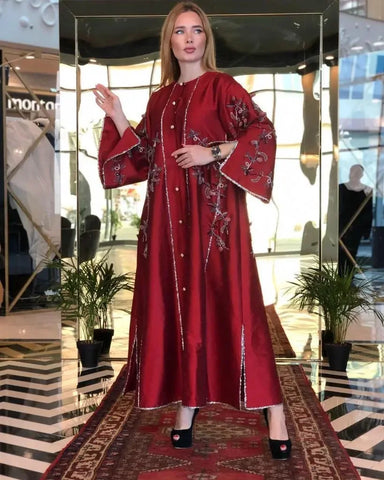 A luxurious, hand-made daraa with sequins and a round neckline 