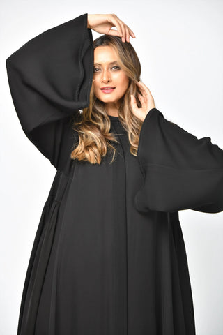 Plain triple-cloche abaya with cuts and pleats from Tahani Boutique
