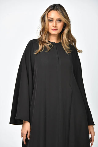 Plain, formal, triple-cloche abaya with vertical cuts from Tahani Boutique